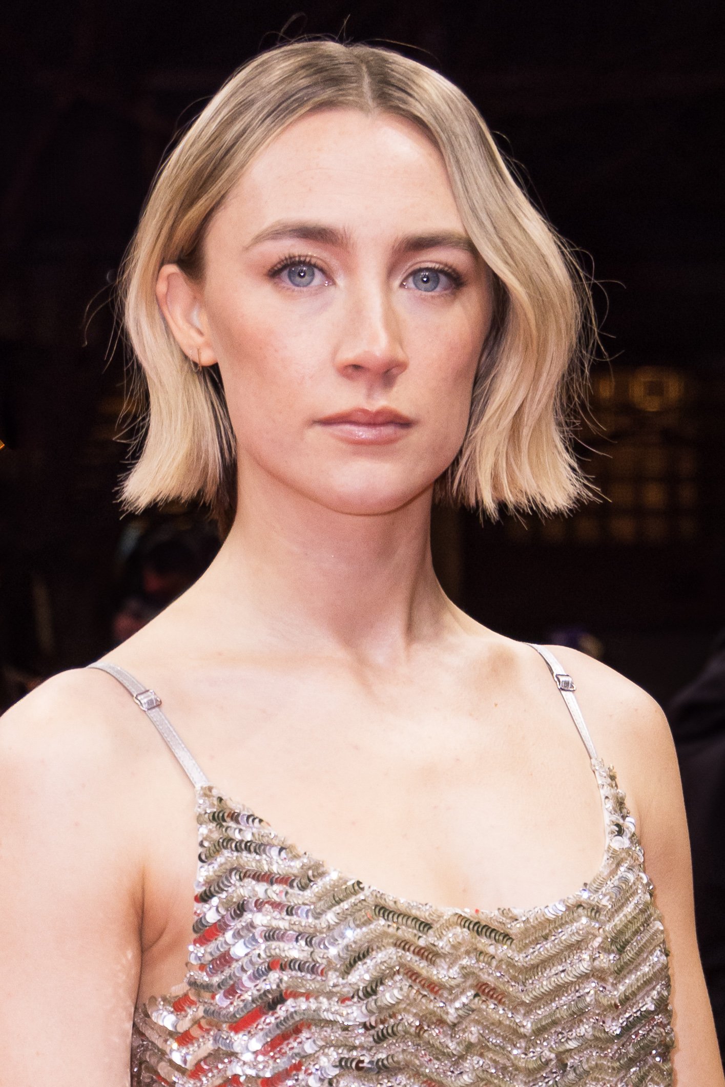 Close-up portrait of Saoirse Ronan looking at the camera at a film festival event.